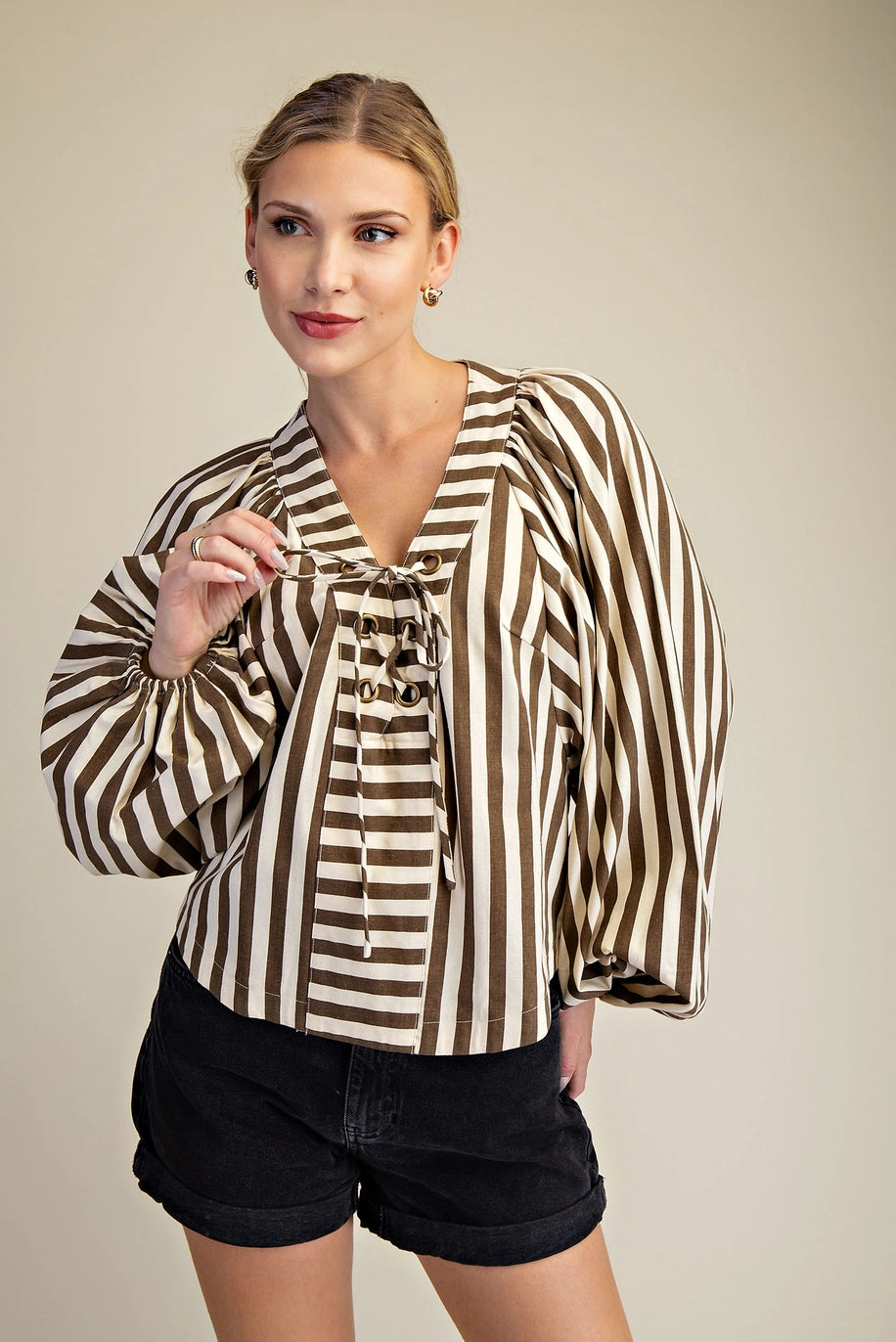 brown and cream striped blouse with long billow sleeves elastic cuffs at wrist open gromet tie up front