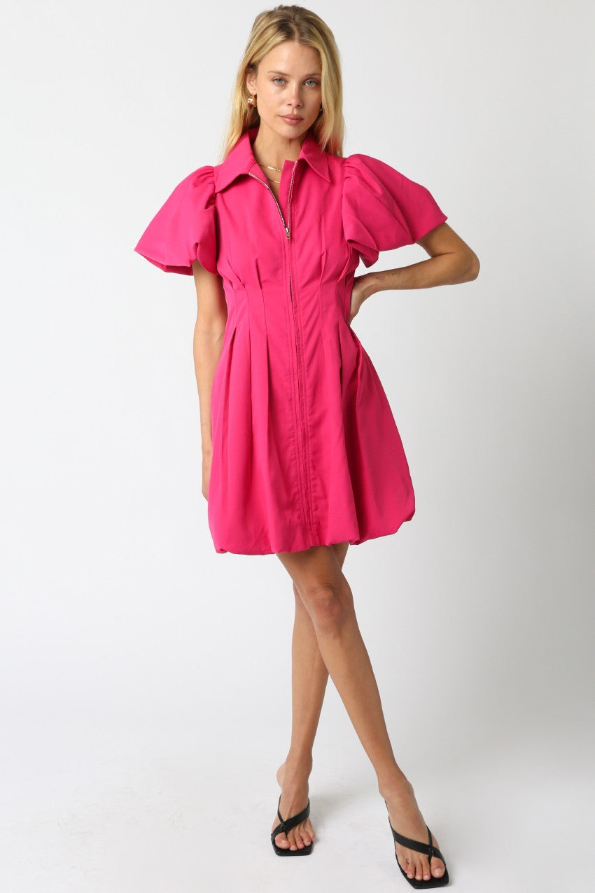 bright pink mini dress with zip up front tapered waist and short puff sleeves