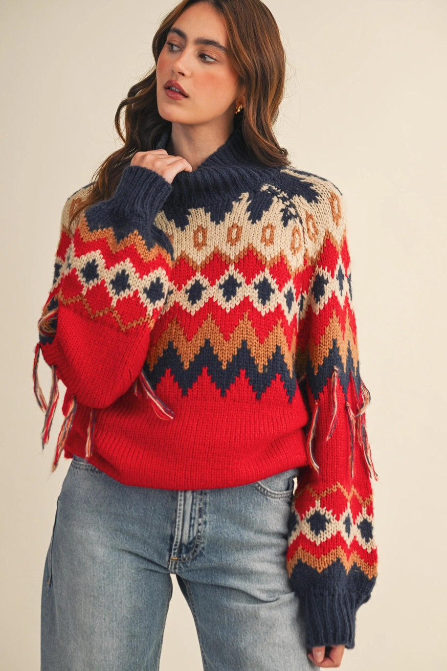 red navy cream and tan long sleeve fair aisle sweater with fringe detail on sleeves