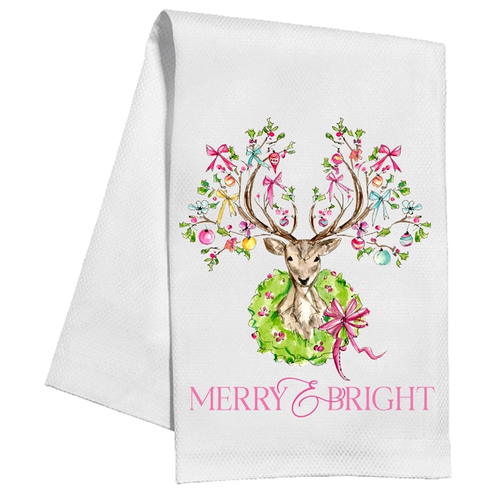 White towel with a festive colorful design of a deer and ornaments, featuring the text 'Merry & Bright'.