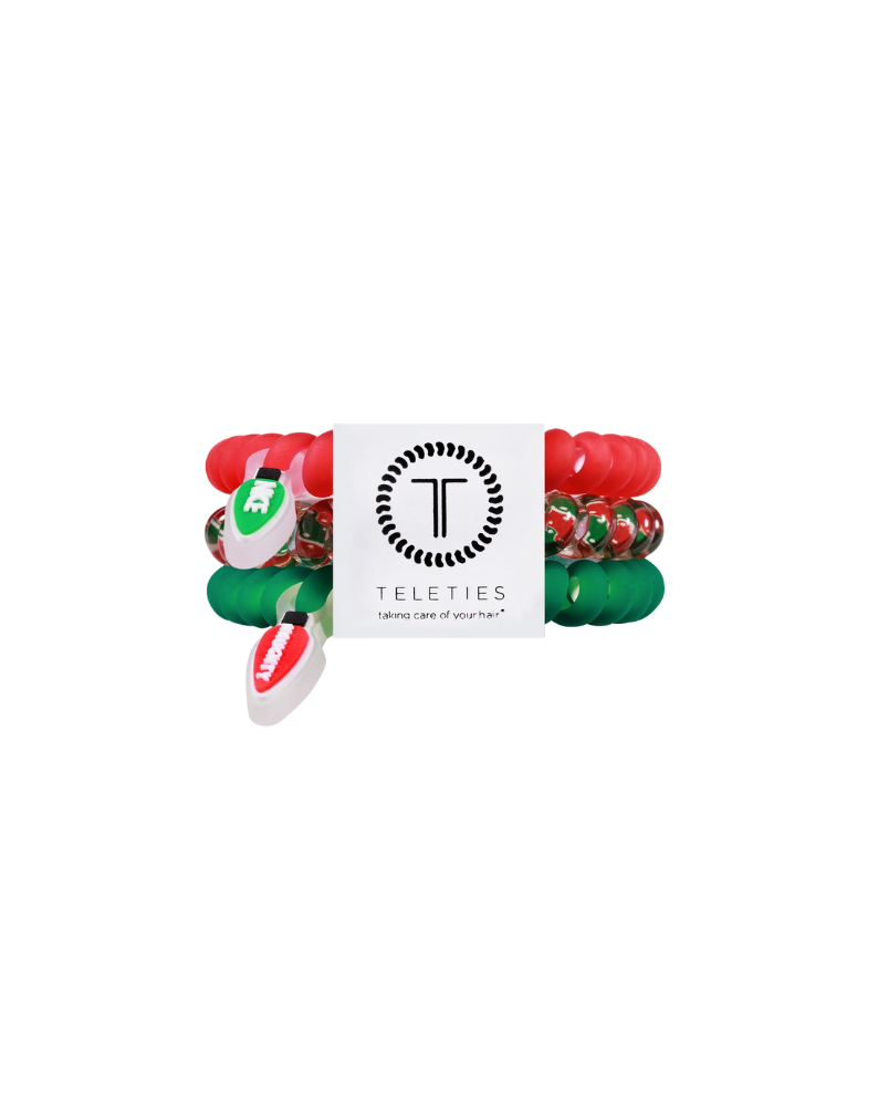 pack of three red and green hair coils with naughty and nice light charms