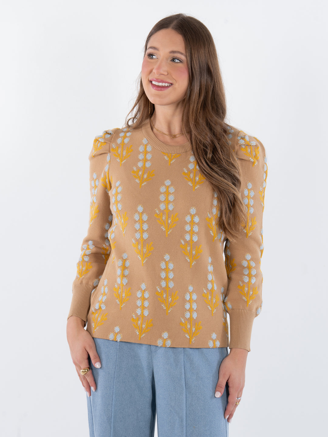 beige light blue and yellow floral knit sweater with round neckline and long sleeves