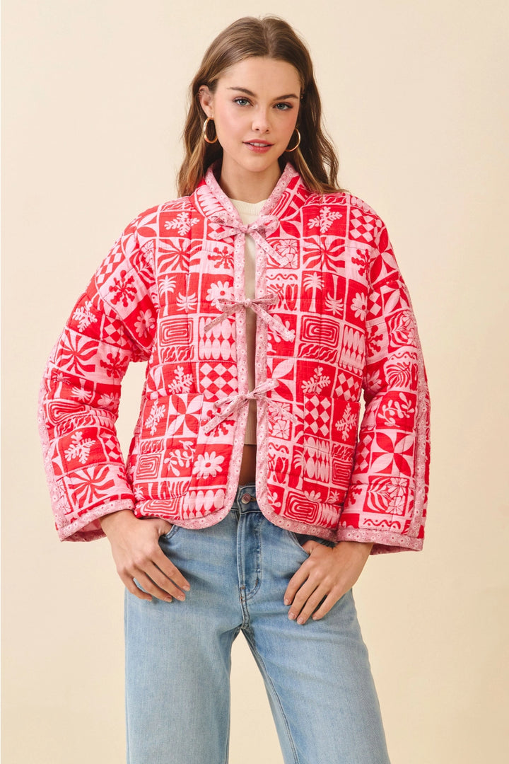 red and pink geo patterned tie front quilted jacket with long sleeves 