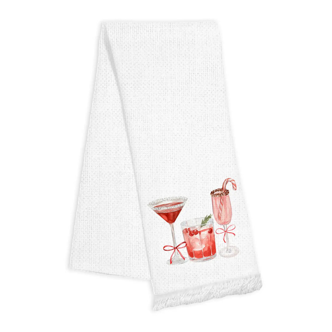 White towel with cocktail-themed design and fringe detail