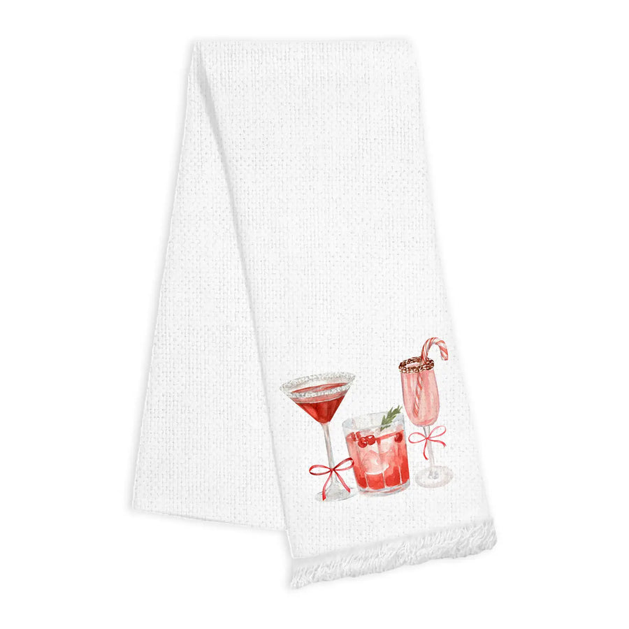 White towel with cocktail-themed design and fringe detail