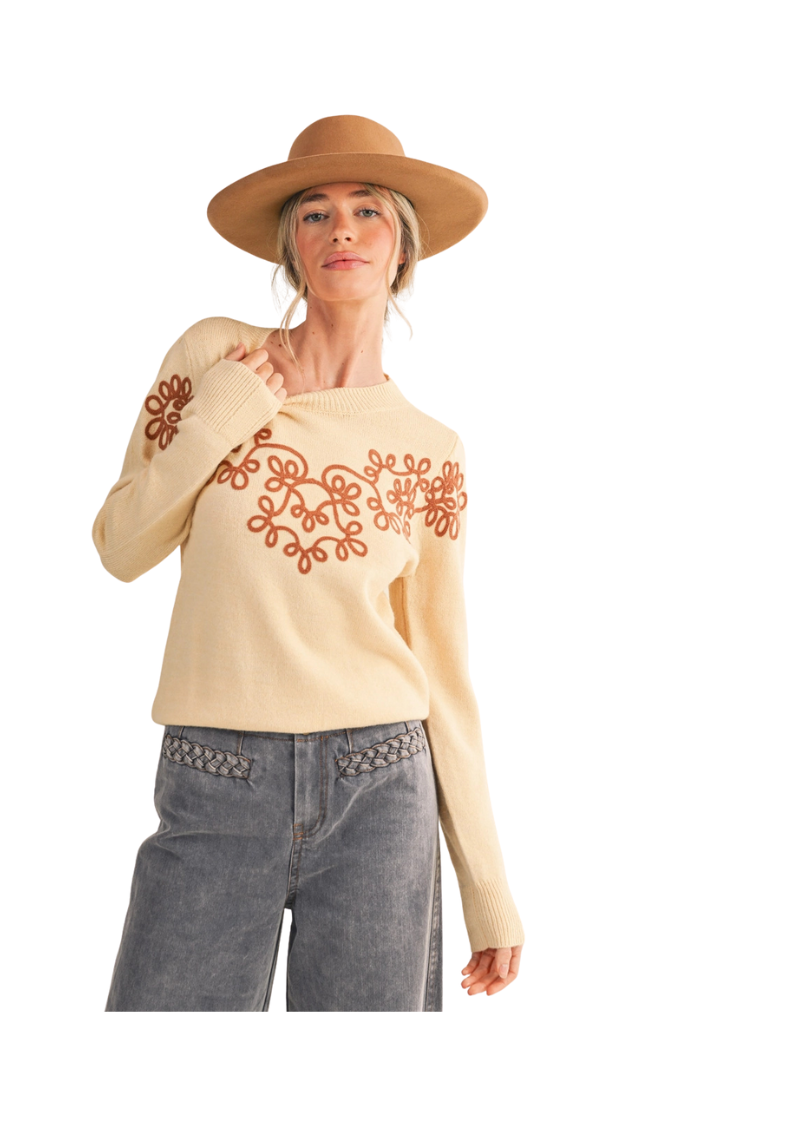cream long sleeve sweater with camel colored swirly embroidered 