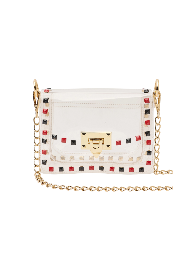 transparent handbag with red and black studded details and a gold 