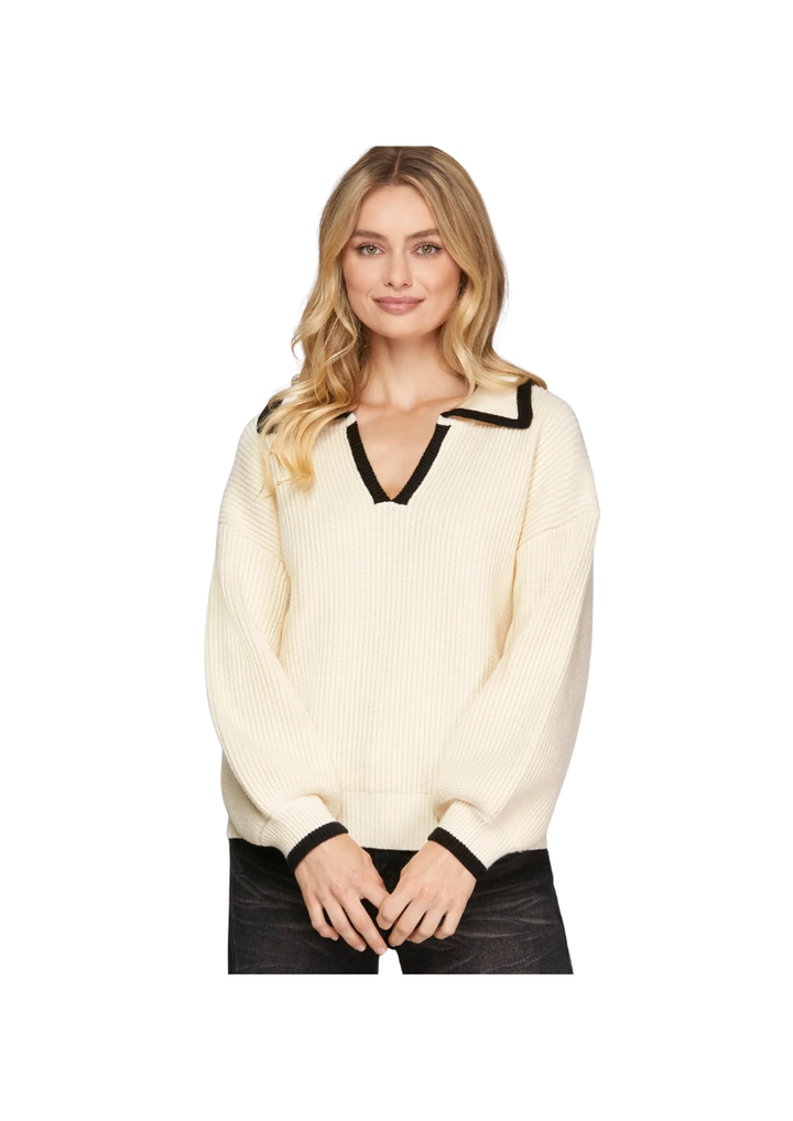 cream long sleeve v neck sweater with black contrasting trim
