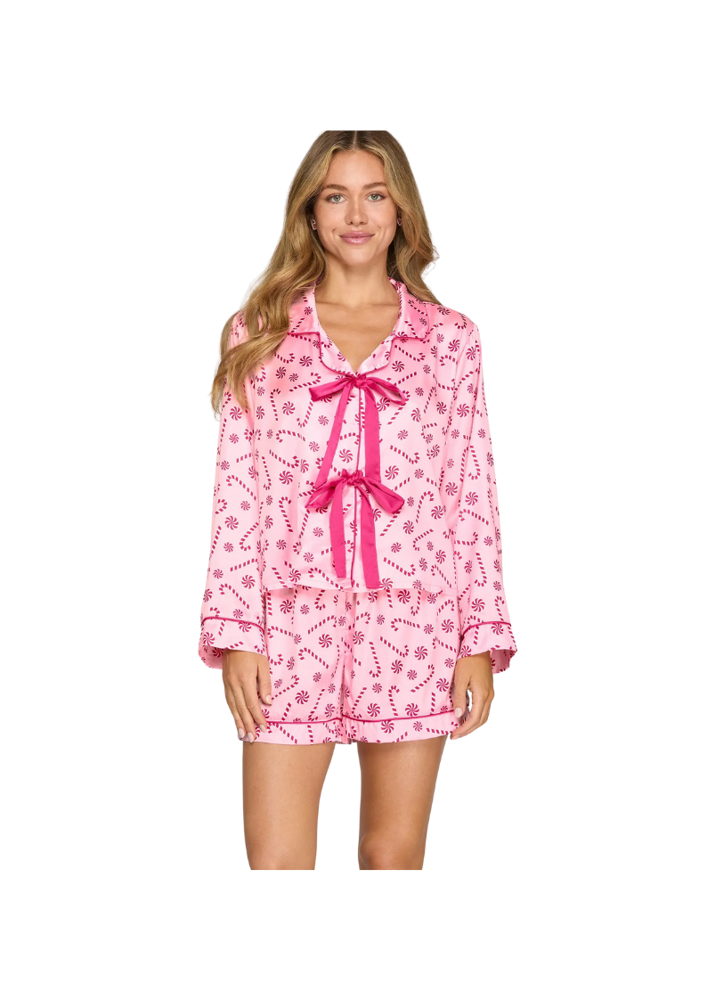 pink long sleeve satin pajama top with two dark pink bows on front and candy cane/mint print 