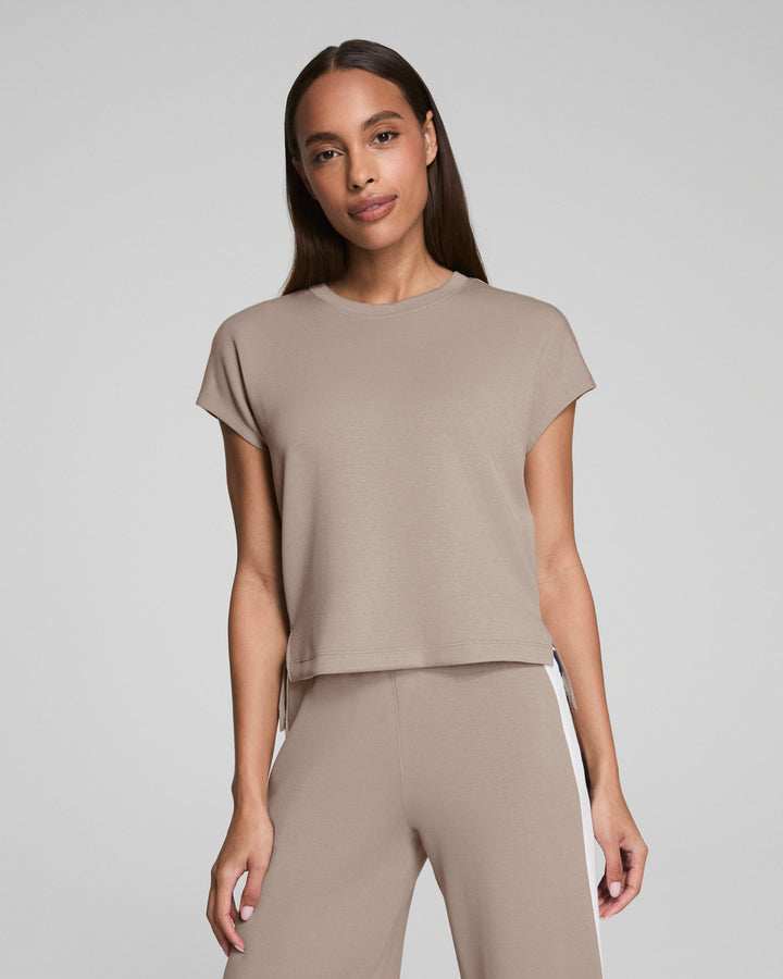 beige athleisure top with round neck and short sleeves
