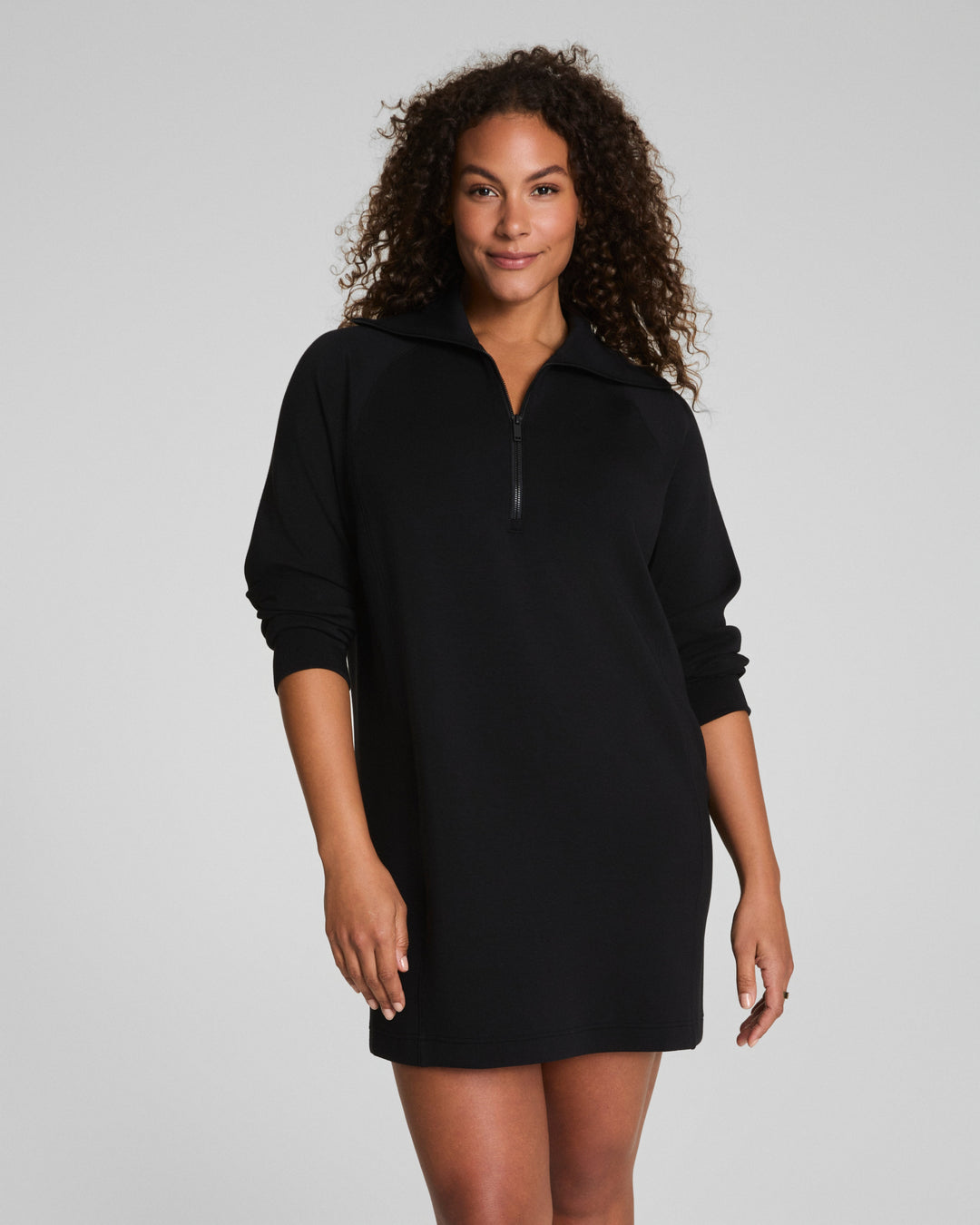 athleisure black mini dress with a quarter zip front 